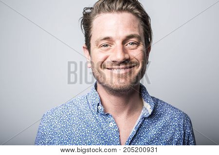 A Portrait of european man isolated over white background. Caucasian male model in studio shoot.