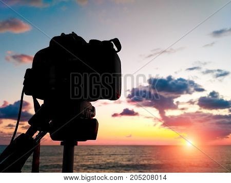 Capture Time-lapse Video On A Slr Camera. The Sun Goes Down The Horizon Of The Sea. Beautiful Sunset