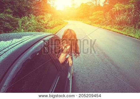 Asian women travel relax in the holiday. driving a car traveling happily.