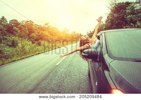 Asian women travel relax in the holiday. driving a car traveling happily.
