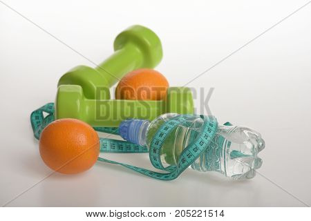 Dumbbells In Bright Green Color, Water Bottle, Measure Tape, Fruit