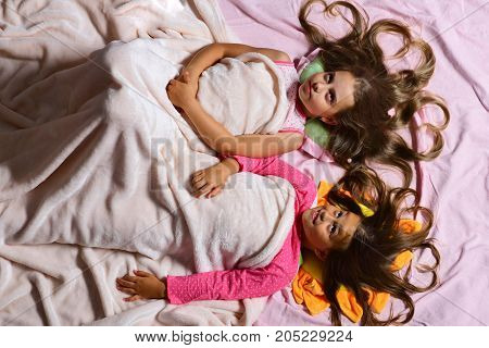 Schoolgirls In Pink Pajamas Wallow On Colorful Pillows, Topview