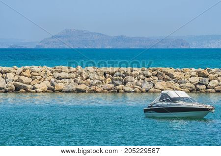 White cabin cruiser over blue water. A luxury private motor yacht under way on Black Sea sea
