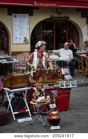 Paris France - July 24 2011: Street musician play organ in Place du Tertre