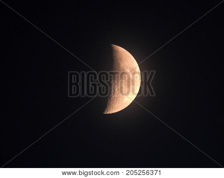 Photo of moon phase catching craters on it's surface