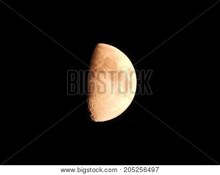 Photo of moon phase catching craters on it's surface