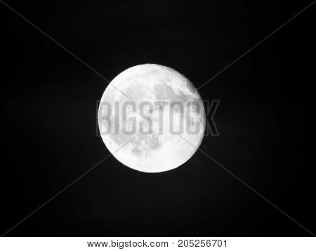 Photo of moon phase catching craters on it's surface