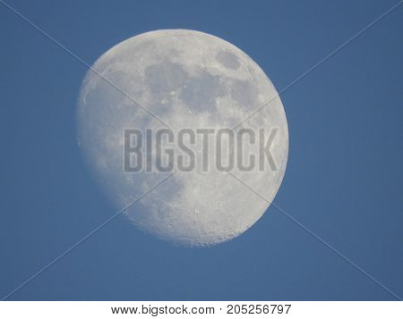 Photo of moon phase catching craters on it's surface