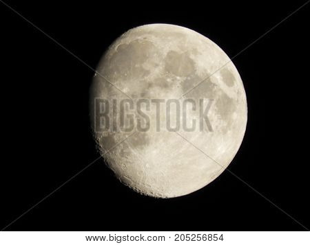 Photo of moon phase catching craters on it's surface