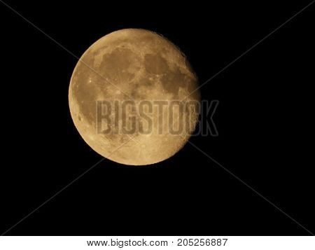 Photo of moon phase catching craters on it's surface