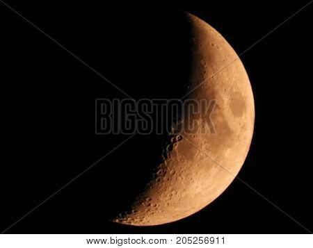 Photo of moon phase catching craters on it's surface