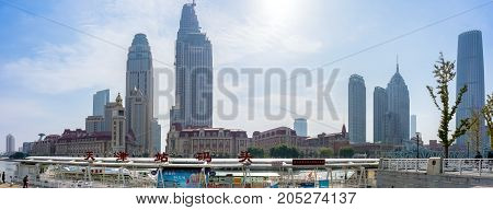 Tianjin, China - Nov 1, 2016: Tianjin Wharf and the commercial skyline across the Haihe River. Buildings in contrasting modern and old architectural style. Panorama view.