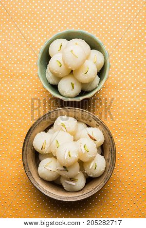 Stock Photo of Rasgulla or sponge Ras Gulla, It is made from ball shaped dumplings of chhena and semolina dough, cooked in light syrup made of sugar.