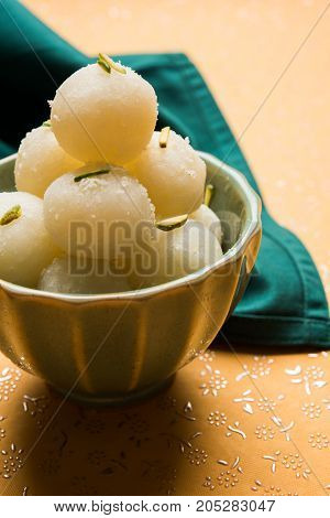 Stock Photo of Rasgulla or sponge Ras Gulla, It is made from ball shaped dumplings of chhena and semolina dough, cooked in light syrup made of sugar.