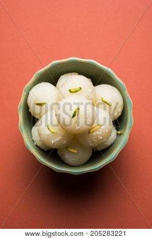 Stock Photo of Rasgulla or sponge Ras Gulla, It is made from ball shaped dumplings of chhena and semolina dough, cooked in light syrup made of sugar.