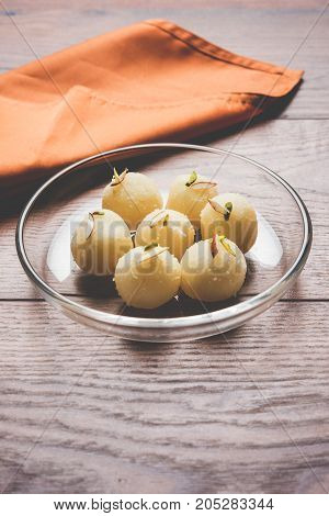 Stock Photo of Rasgulla or sponge Ras Gulla, It is made from ball shaped dumplings of chhena and semolina dough, cooked in light syrup made of sugar.
