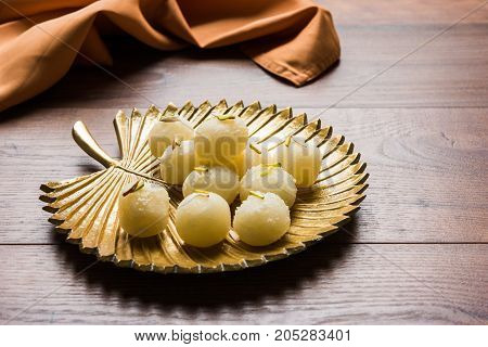 Stock Photo of Rasgulla or sponge Ras Gulla, It is made from ball shaped dumplings of chhena and semolina dough, cooked in light syrup made of sugar.