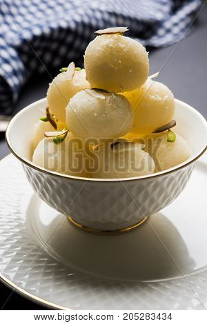 Stock Photo of Rasgulla or sponge Ras Gulla, It is made from ball shaped dumplings of chhena and semolina dough, cooked in light syrup made of sugar.