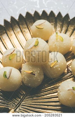 Stock Photo of Rasgulla or sponge Ras Gulla, It is made from ball shaped dumplings of chhena and semolina dough, cooked in light syrup made of sugar.