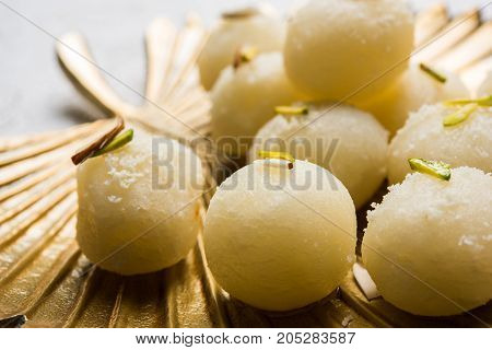 Stock Photo of Rasgulla or sponge Ras Gulla, It is made from ball shaped dumplings of chhena and semolina dough, cooked in light syrup made of sugar.