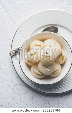 Stock Photo of Rasgulla or sponge Ras Gulla, It is made from ball shaped dumplings of chhena and semolina dough, cooked in light syrup made of sugar.