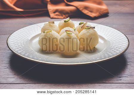Stock Photo of Rasgulla or sponge Ras Gulla, It is made from ball shaped dumplings of chhena and semolina dough, cooked in light syrup made of sugar.