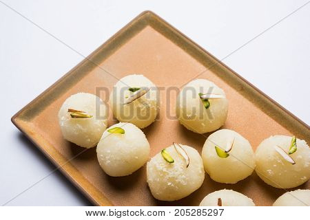 Stock Photo of Rasgulla or sponge Ras Gulla, It is made from ball shaped dumplings of chhena and semolina dough, cooked in light syrup made of sugar.
