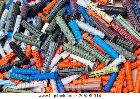large number of multicolored dowels close-up background
