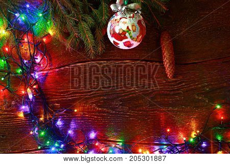 Christmas rustic background - vintage planked wood with lights and free text space.