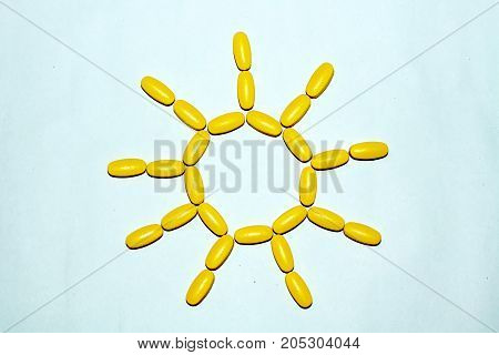 Tablets and capsules are lined in the form of the sun.