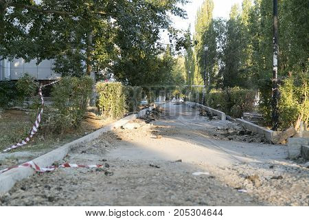 The repair of the road. Pictures of repairing of pedestrian sidewalk. Setting the border