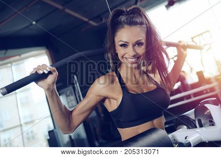 Sexy Athletic Young Girl Training Back In Gym