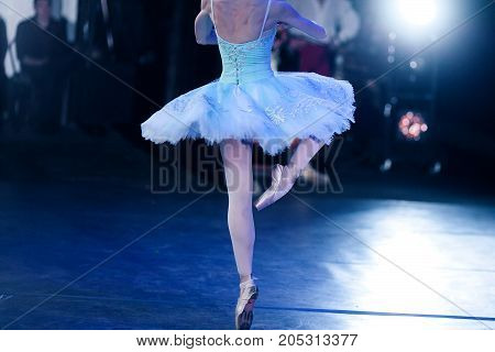 perfection, ballet, strength concept. slender ballerina dressed in insanely beautiful dress with tutu making fouette and all her muscles are tight with tension