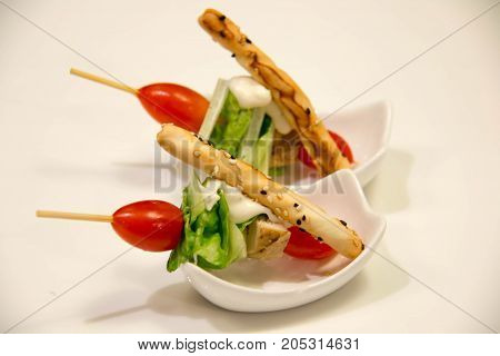A skewers with cherry tomatoes and vegetale