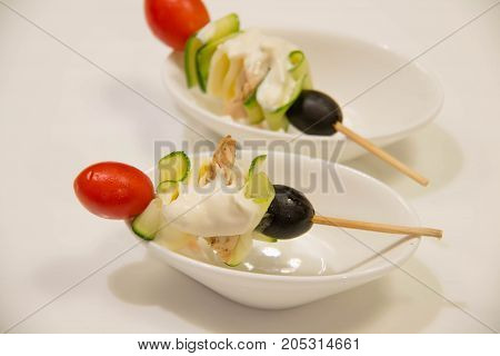 A skewers with cherry tomatoes and vegetale
