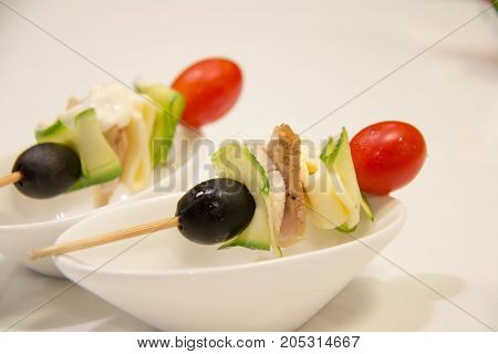 A skewers with cherry tomatoes and vegetale