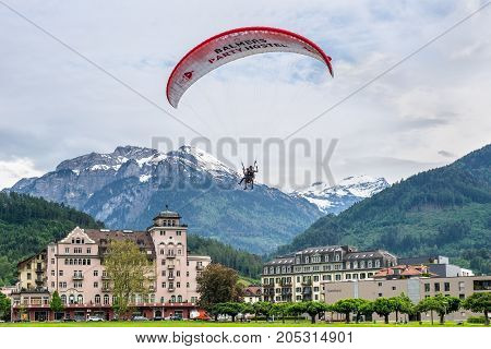 Interlaken Switzerland - May 26 2016: Tandem paragliding flights over the Swiss Alps in Interlaken Switzerland.