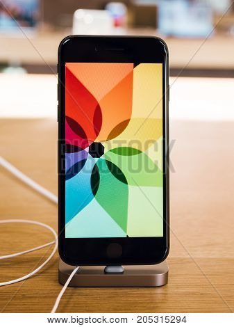 PARIS FRANCE - SEP 22 2017: New iPhone 8 and iPhone 8 Plus as well the updated Watch TV 4k goes on sale today in Apple Store with colorful animation screen demonstration oled screen super retina display