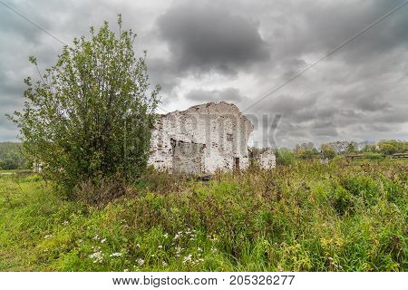 The old destroyed cowshed of the Soviet period in Russia