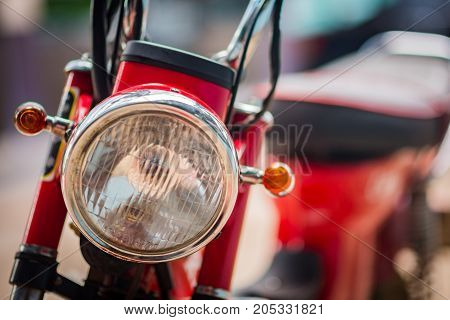 Motorcycle on the road motorcycle headlamp closeup