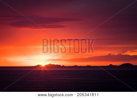 Iles Sanguinaires Silhouetted Against A Dramatic Orange Sunset