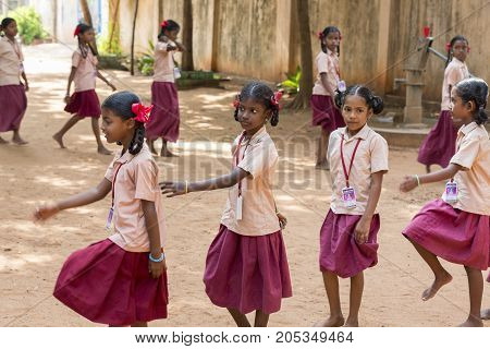 PONDICHERY PUDUCHERY INDIA - SSEPTEMBER 04 2017. School parade of each monday morning with children students in uniforms. They walk sing and pray before going in the classrooms.
