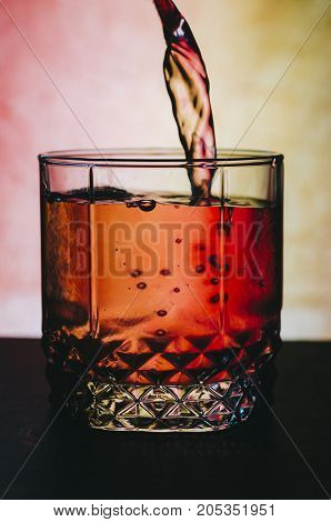 Red alcohol cocktail on the bar table