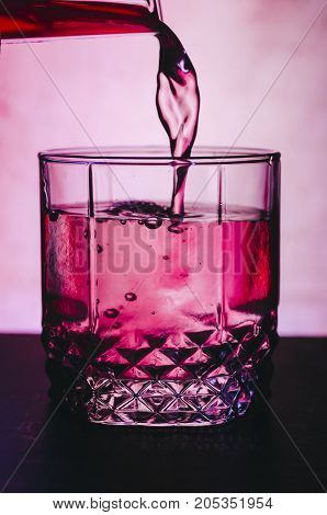 Red alcohol cocktail on the bar table