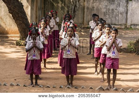 PONDICHERY PUDUCHERY INDIA - SSEPTEMBER 04 2017. School parade of each monday morning with children students in uniforms. They walk sing and pray before going in the classrooms.