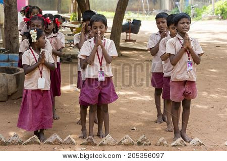 PONDICHERY PUDUCHERY INDIA - SSEPTEMBER 04 2017. School parade of each monday morning with children students in uniforms. They walk sing and pray before going in the classrooms.