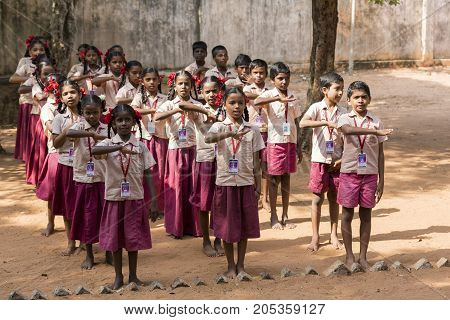 PONDICHERY PUDUCHERY INDIA - SSEPTEMBER 04 2017. School parade of each monday morning with children students in uniforms. They walk sing and pray before going in the classrooms.