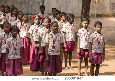 PONDICHERY PUDUCHERY INDIA - SSEPTEMBER 04 2017. School parade of each monday morning with children students in uniforms. They walk sing and pray before going in the classrooms.