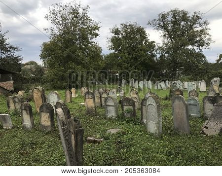 Teresva, Ukraine, September 18, 2017; An Old Jewish Cemetery. Shattered Gravestones Stand Among The