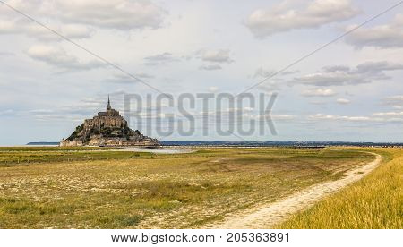 View of the footpath leading to the famous Mont Saint Michel Abbey in Normandy in North of France.